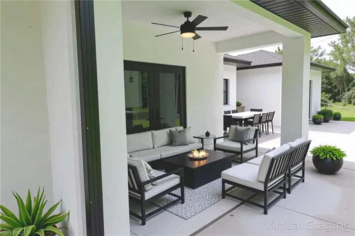 Spare room featuring marble finish flooring and a ceiling fan