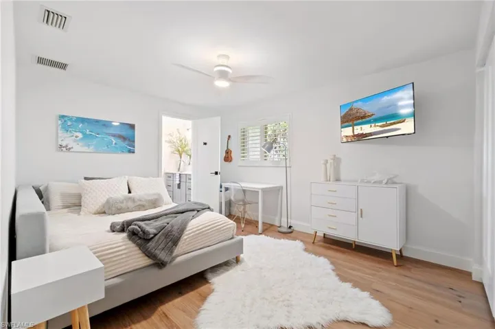 2nd guest Bedroom with ceiling fan and light hardwood / wood-style floors