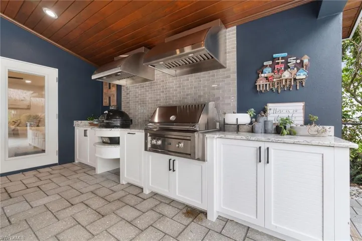 View of patio / terrace with an outdoor kitchen and a grill