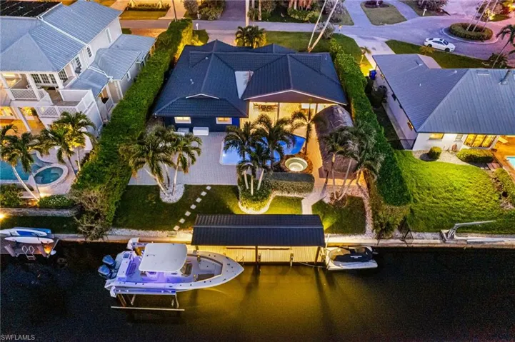 Bird's eye arial waterfront view of fully renovated estate property featuring a stunning intercostal water view.Sought after Royal Harbor Neighborhood.
