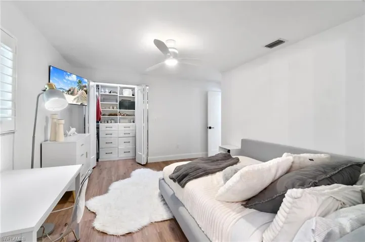 2nd Bedroom with light hardwood / wood-style flooring and ceiling fan