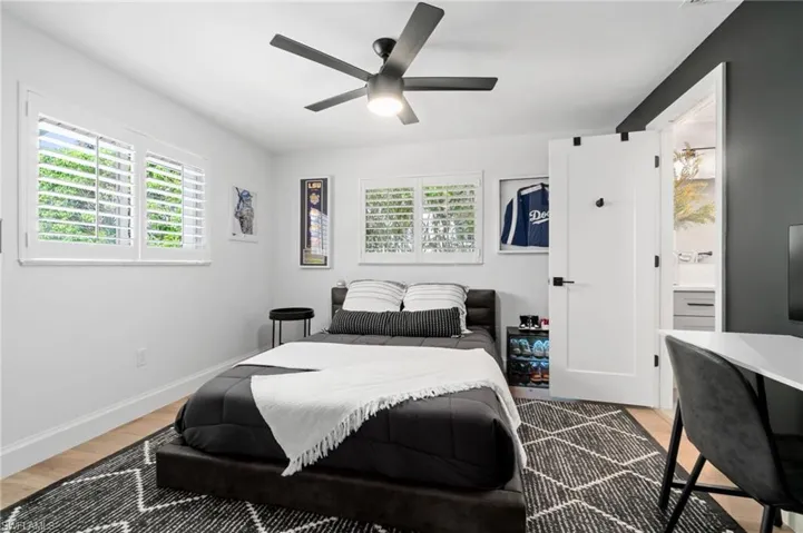 3rd Bedroom featuring hardwood / wood-style flooring, ceiling fan, and ensuite bathroom