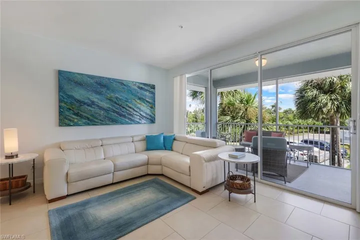 Living room featuring light tile patterned floors