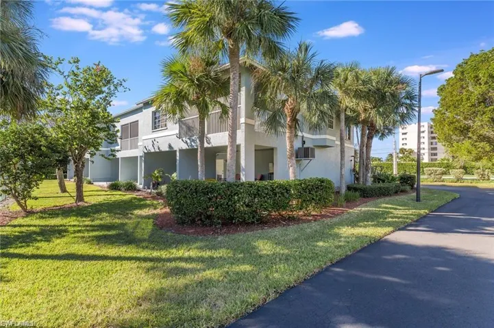 View of side of property with a yard