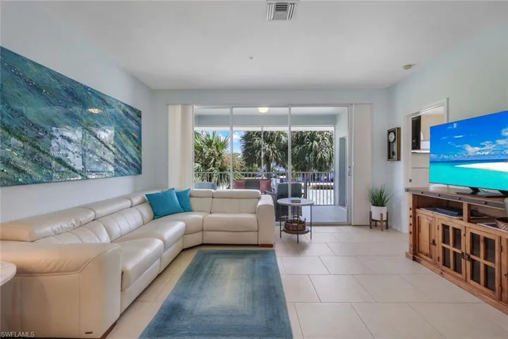 Living room featuring light tile patterned flooring