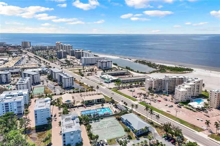 Drone / aerial view with a water view and a beach view