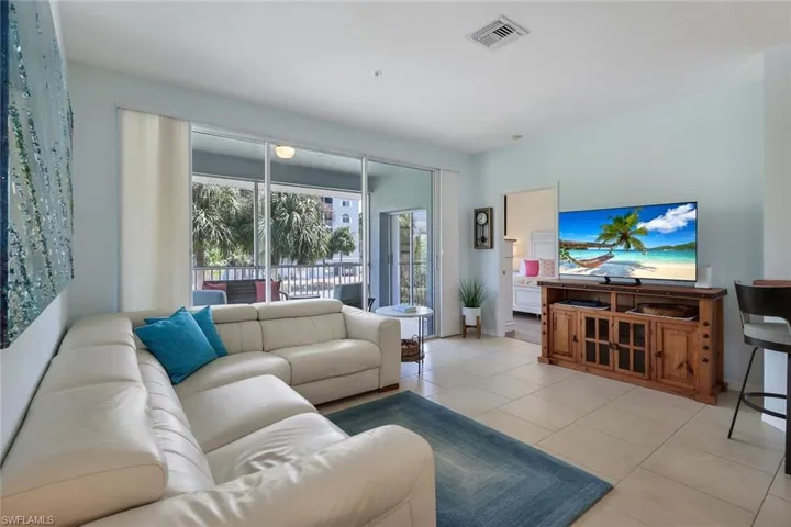 Living room featuring light tile patterned floors