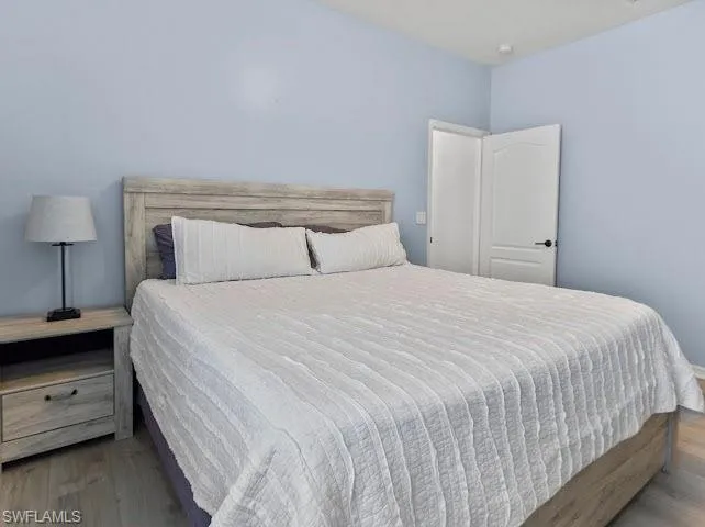 Bedroom with wood finished floors