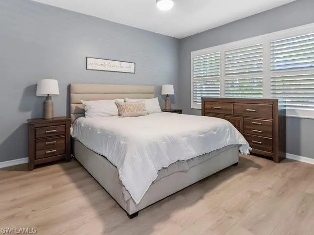 Bedroom featuring light wood-style flooring and ceiling fan