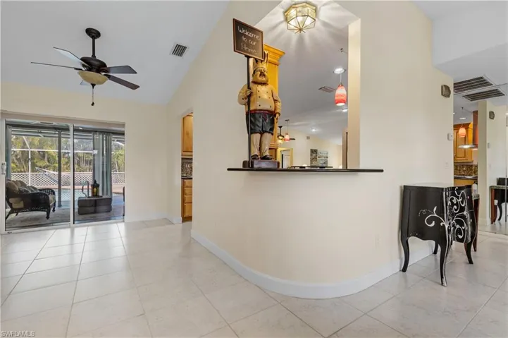 View of Dining/Living Room area with service opening to kitchen