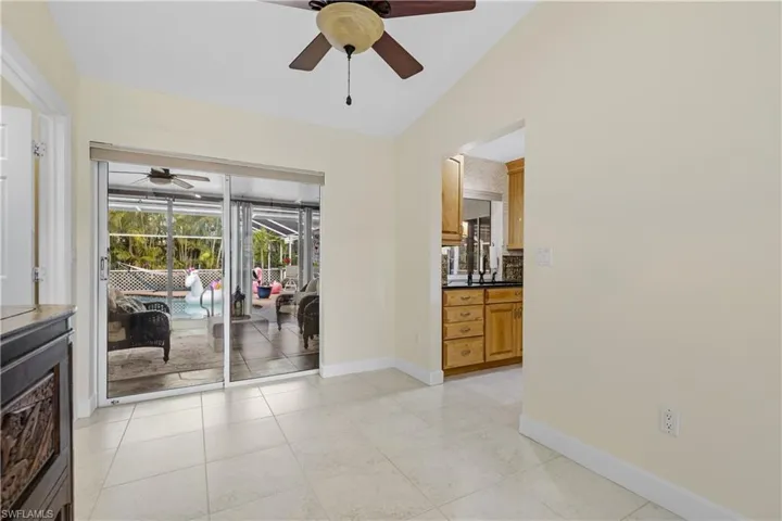 Dining Area off of the Kitchen with sliding glass doors to Lanai and Pool