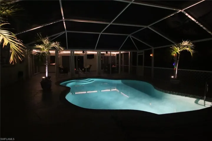 Nighttime view of pool area looking towards the Lanai