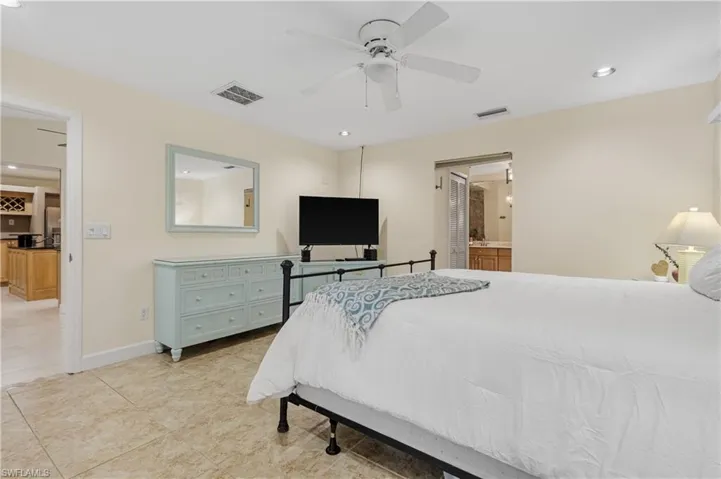 Master Bedroom with door to Dining Area (left) and door to Master Bathroom (right)