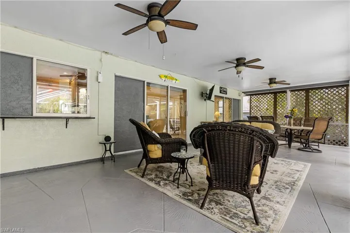 Large under truss Lanai with pocketing slider doors and service window