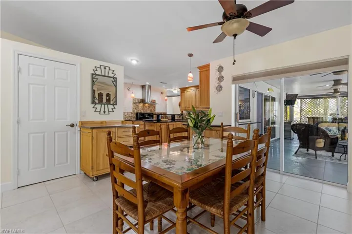 Casual Dining Area off of the Kitchen and pocketing sliding glass doors to Lanai