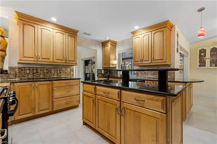 Kitchen has lots of cabinets for storage