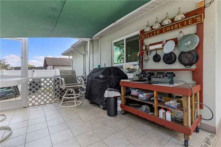 Screened-In Grilling area by the pool