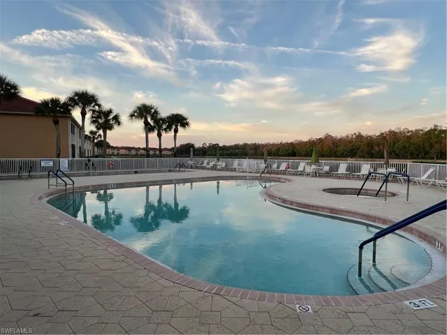 Pool at dusk with a patio