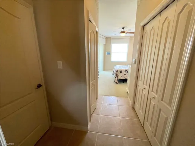 Hall with light tile patterned floors