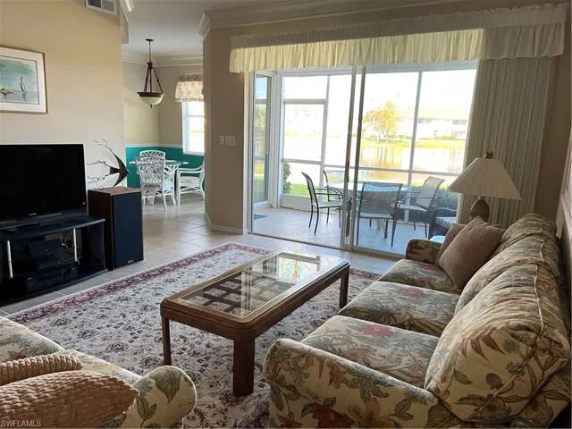 Tiled living room with crown molding