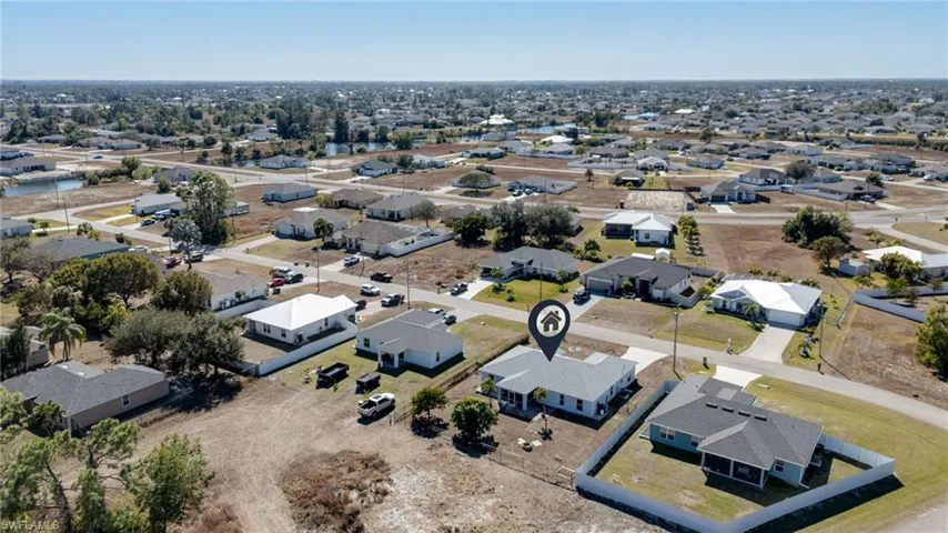 Aerial overview of property's location with nearby suburban area