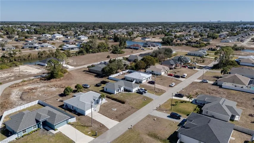 Aerial view of property's location with nearby suburban area