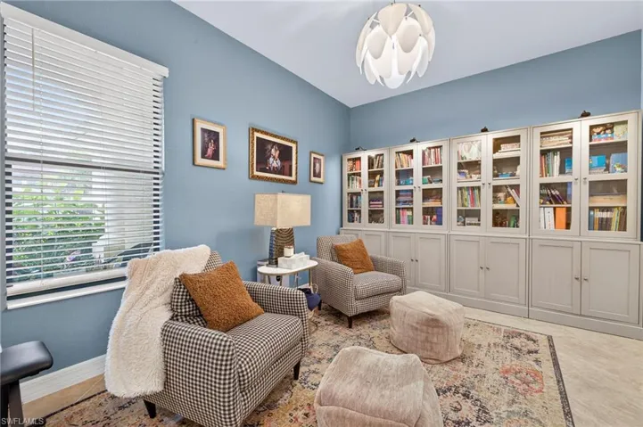 Sitting room featuring tile patterned flooring and baseboards