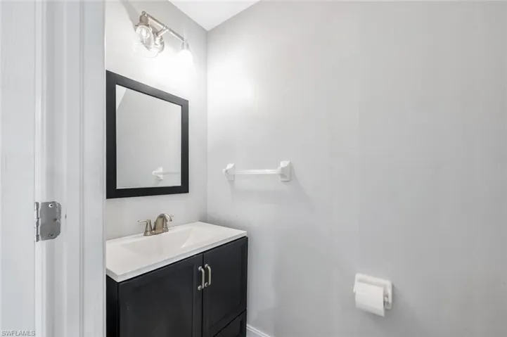 Half bathroom featuring vanity