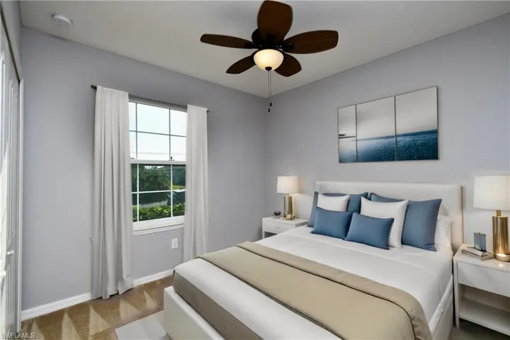 Bedroom featuring ceiling fan, light colored carpet, and a closet