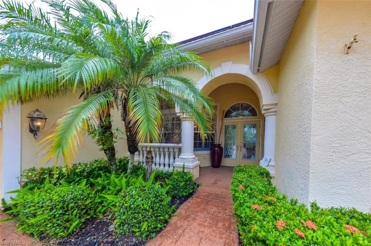 View of exterior entry featuring french doors