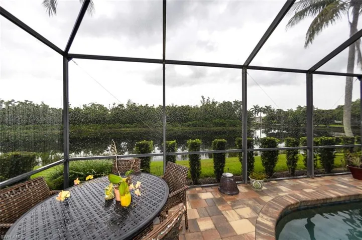 Sunroom with a water view