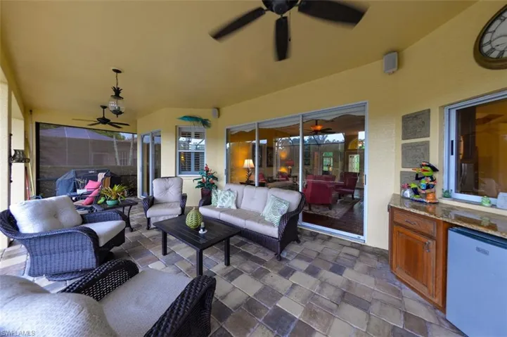 View of patio featuring outdoor lounge area and ceiling fan