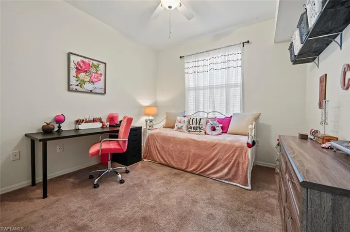 Bedroom with ceiling fan and carpet flooring