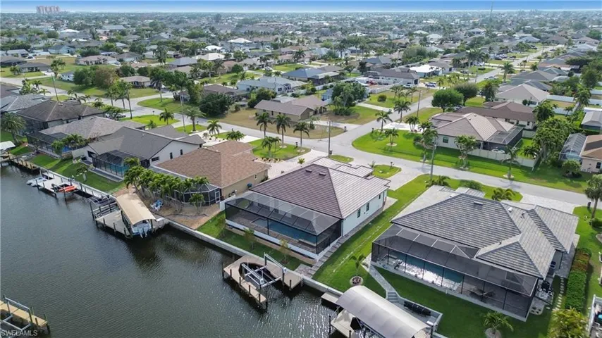 Drone / aerial view with a residential view and a water view