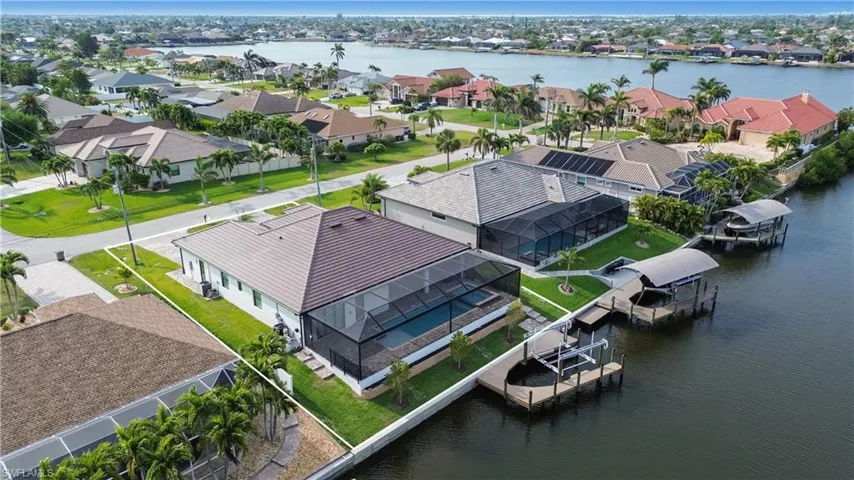 Bird's eye view featuring a water view and a residential view