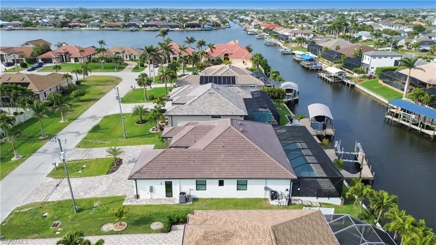 Drone / aerial view with a residential view and a water view