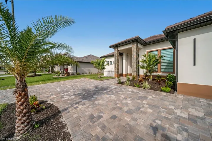View of patio with driveway and an attached garage