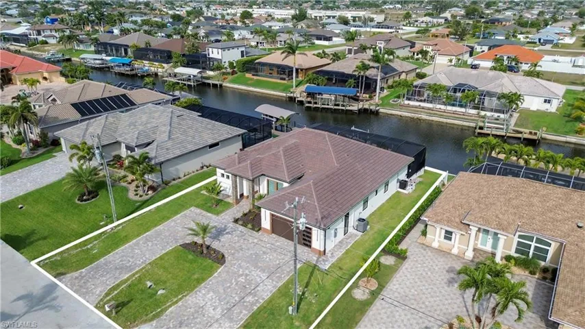Aerial view featuring a water view and a residential view