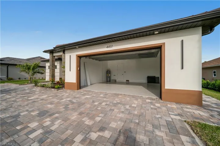 Garage with decorative driveway