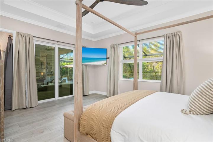 Relax in this spacious owner's suite, with an entrance/exit to the pool area.