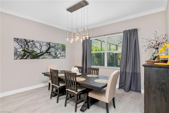 Enjoy a home cooked meal in the dining room the overlooks the pool/outdoor area.