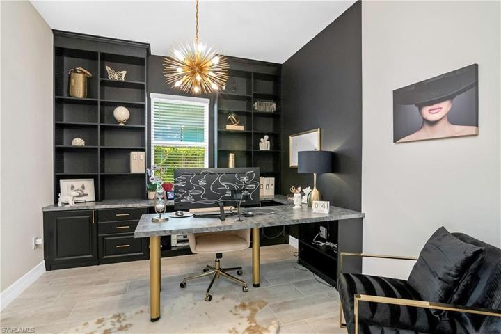 The den/study is the perfect spot for your home office and has CUSTOM built-ins!