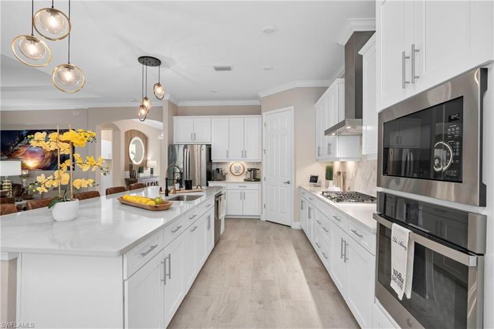 Kitchen is Open, Spacious, and includes a large walk-in pantry.