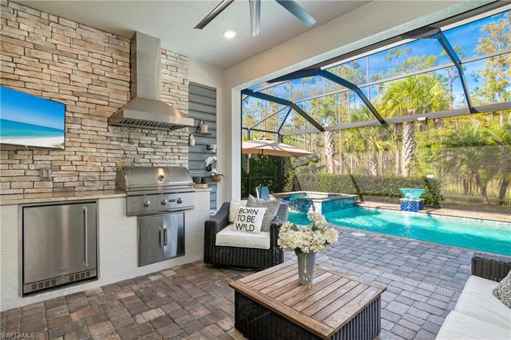 Enjoy the built in outdoor kitchen, with grill and refrigerator. Great for entertaining!