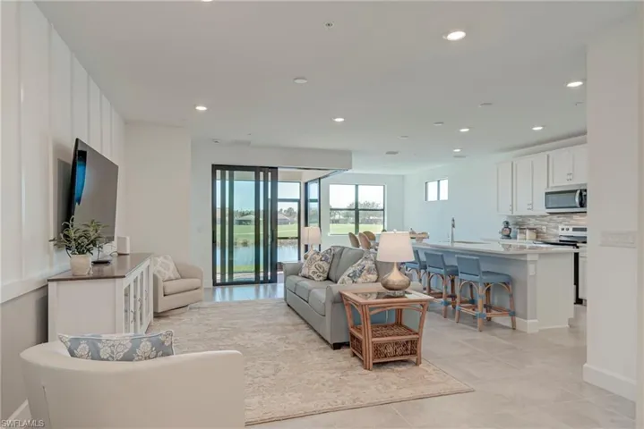 Family room featuring recessed lighting and zero corner entry doors