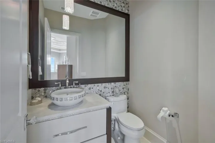 Powder room across from office/den.