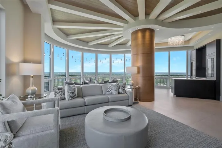 The great room encompasses this living space, a dining area, the kitchen and a bar.