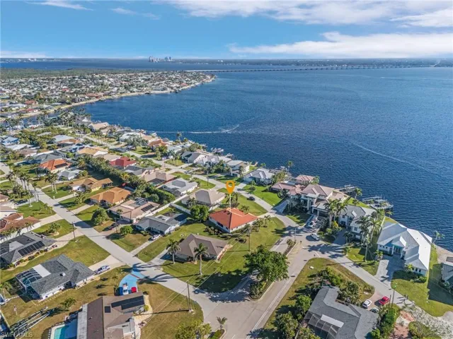 Birds eye view of property on Riverfront street featuring a water view