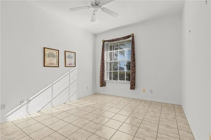 Tiled bedroom #4 featuring ceiling fan