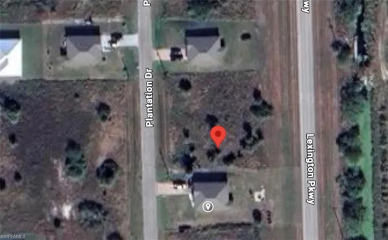 Aerial overview of property's location with property parcel outlined
